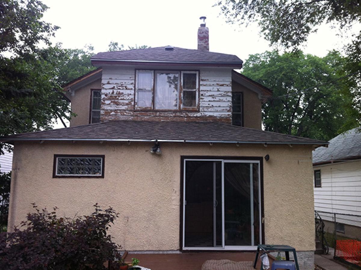 Before (Fadded Stucco & Peeling Wood Siding)